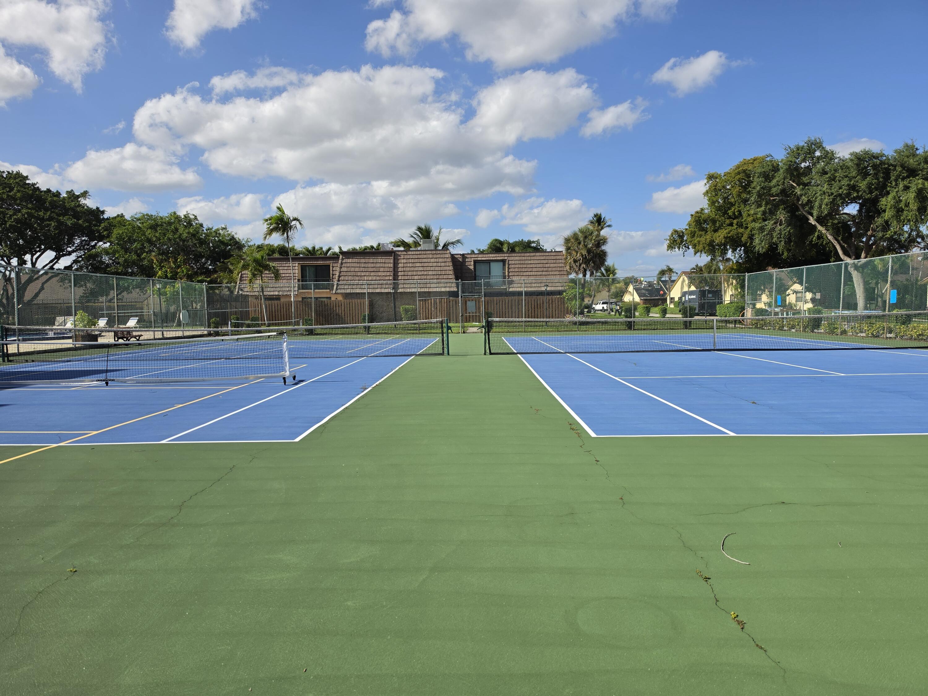 401 Springdale Circle Palm Springs, FL 33461 - Photo 27 of 31 a view of a tennis court