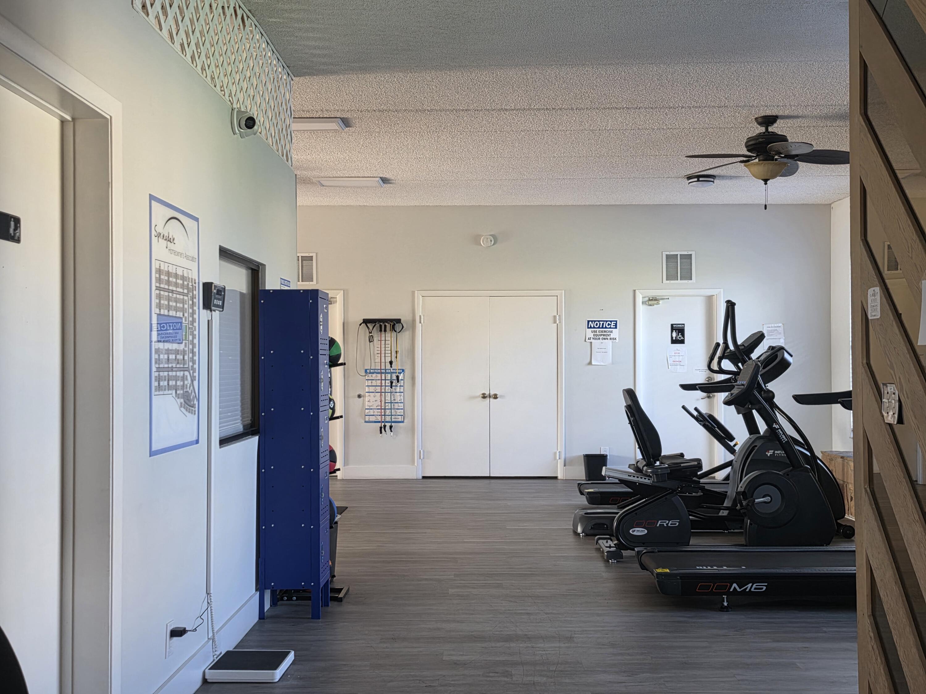 401 Springdale Circle Palm Springs, FL 33461 - Photo 29 of 31 a view of a room with gym equipment