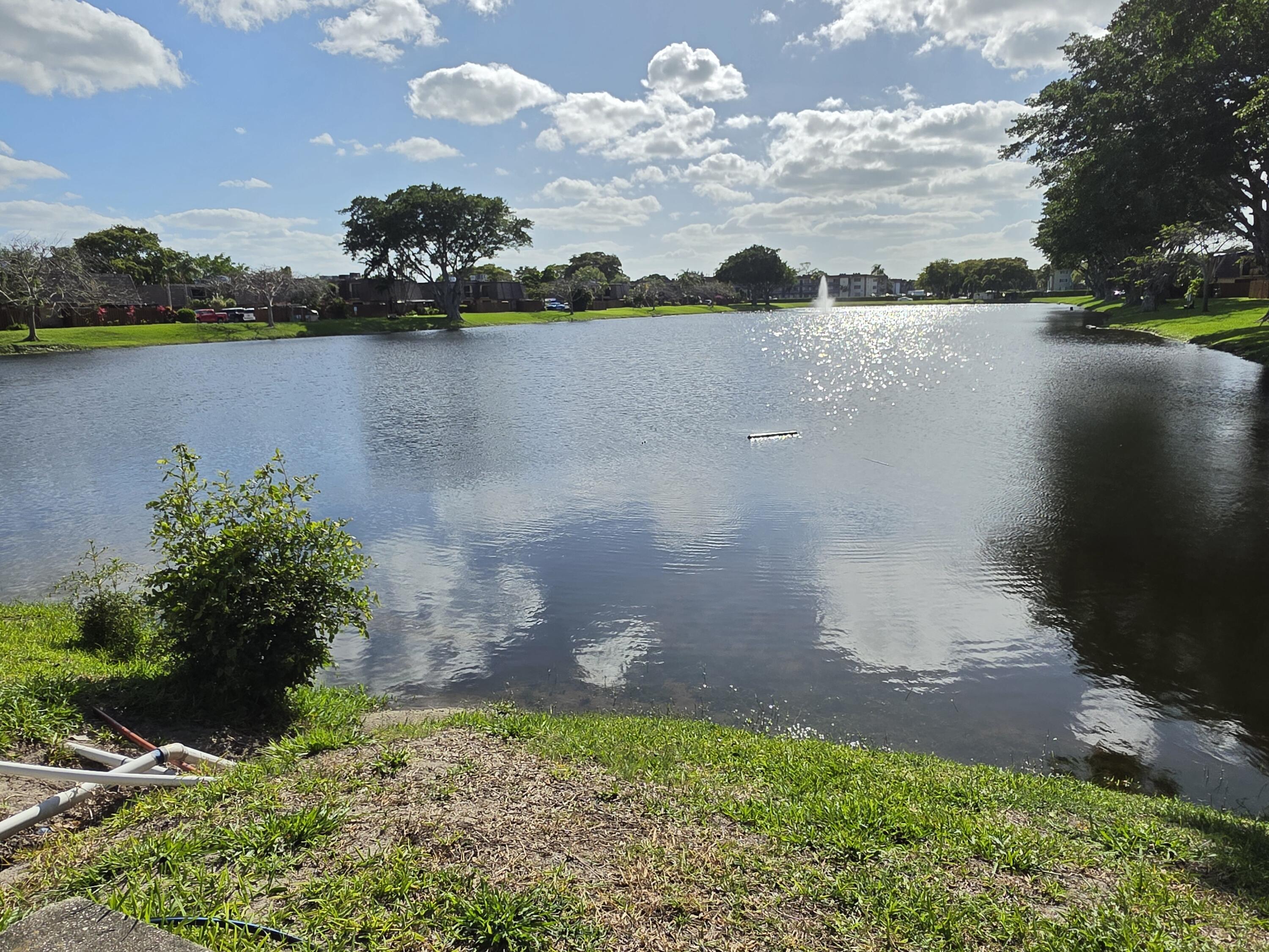 401 Springdale Circle Palm Springs, FL 33461 - Photo 31 of 31 a view of a lake
