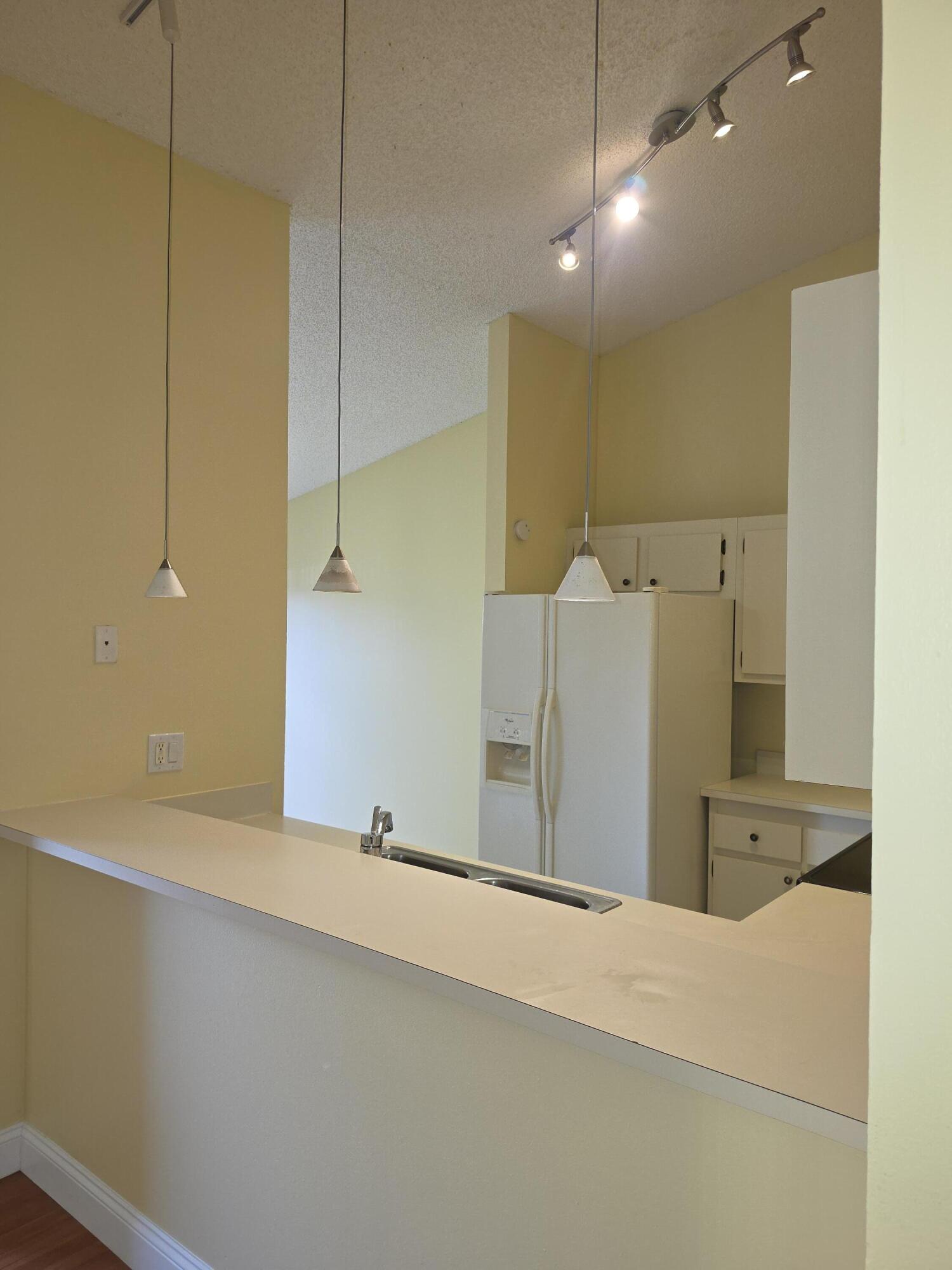 401 Springdale Circle Palm Springs, FL 33461 - Photo 7 of 31 a bathroom with a sink and mirror