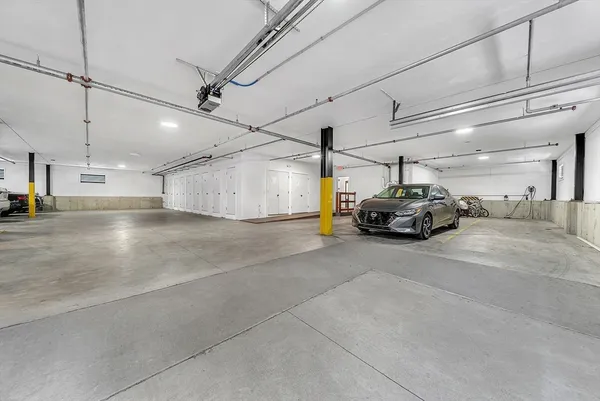 a view of parking space with parked cars