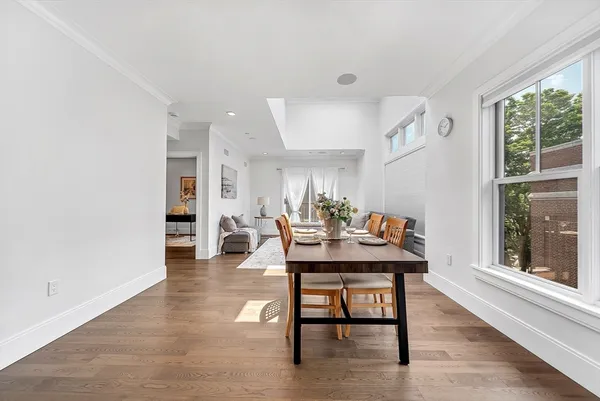 a dining room with furniture and window