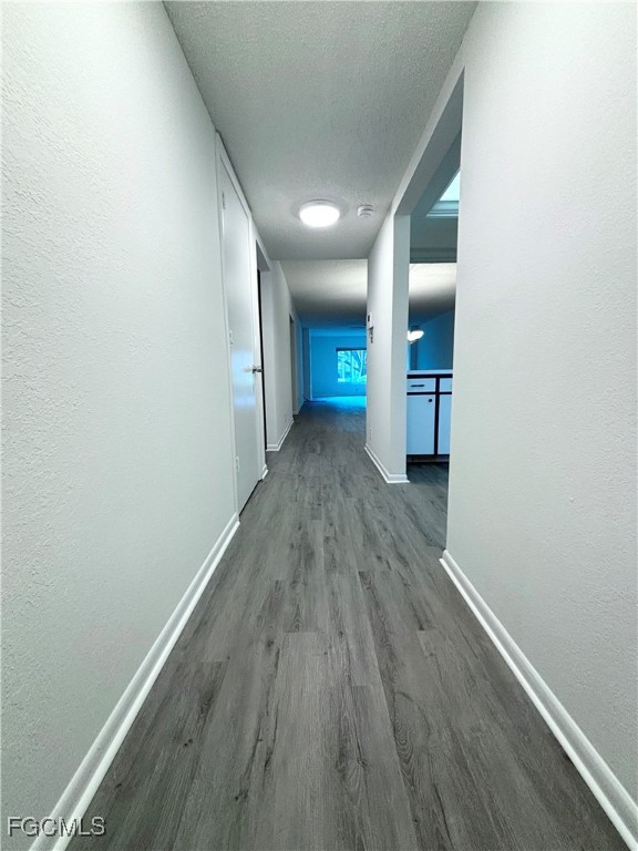 2264 Winkler Avenue, Unit 107 Fort Myers, FL 33901 - Photo 16 of 17 a view of a hallway with wooden floor