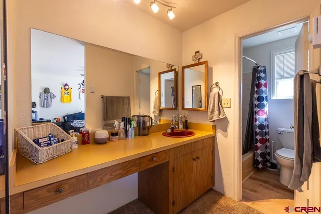 a bathroom with a toilet and shower