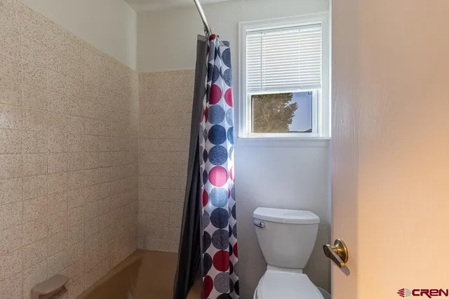 a en suite bathroom with a sink and a bed