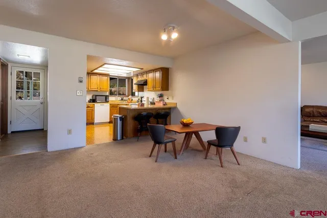 a view of a workspace with furniture and a livingroom