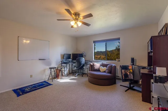 a bathroom with a double vanity sink mirror and toilet