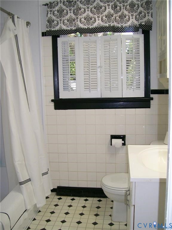 1243 Peck Road North Chesterfield, VA 23235 - Photo 12 of 19 a bathroom with a toilet a sink and a window