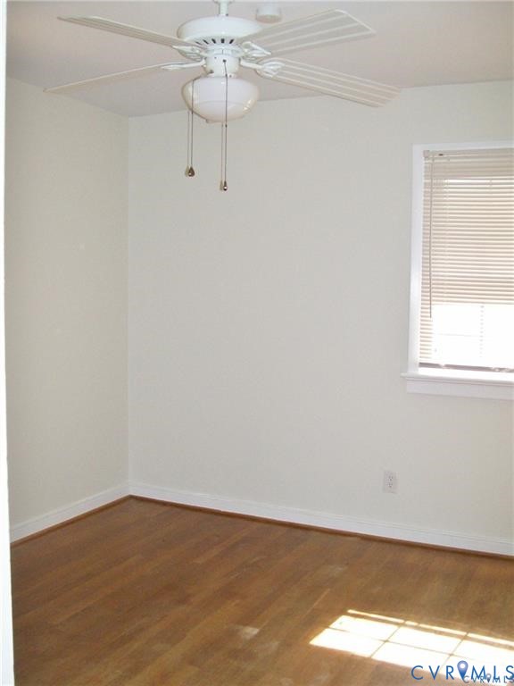 1243 Peck Road North Chesterfield, VA 23235 - Photo 13 of 19 a view of an empty room with wooden floor and a window