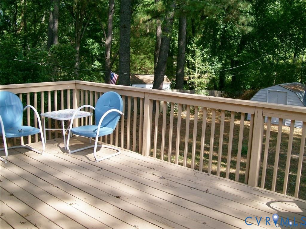 1243 Peck Road North Chesterfield, VA 23235 - Photo 17 of 19 a view of roof deck with chairs and wooden fence