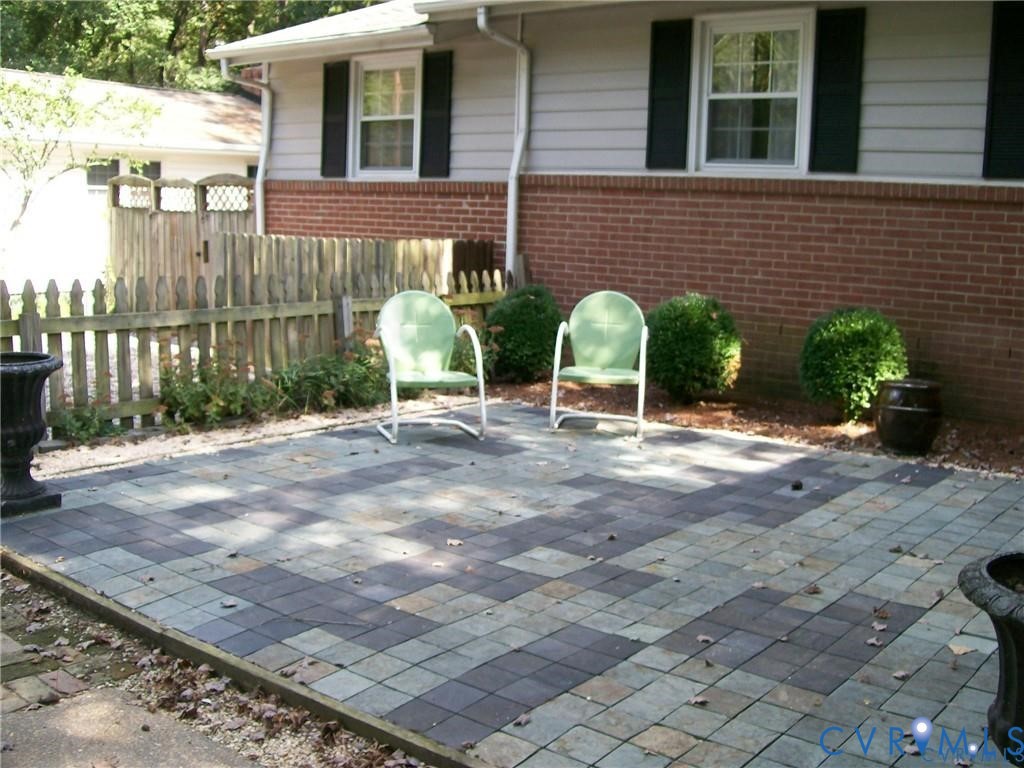 1243 Peck Road North Chesterfield, VA 23235 - Photo 5 of 19 a view of a chairs with table in backyard