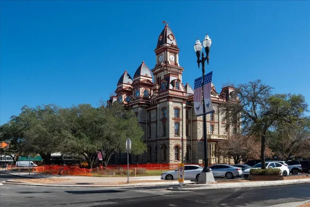 a view of a street with cars on the road