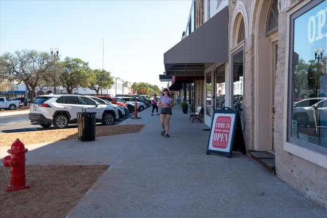 a view of a street with cars