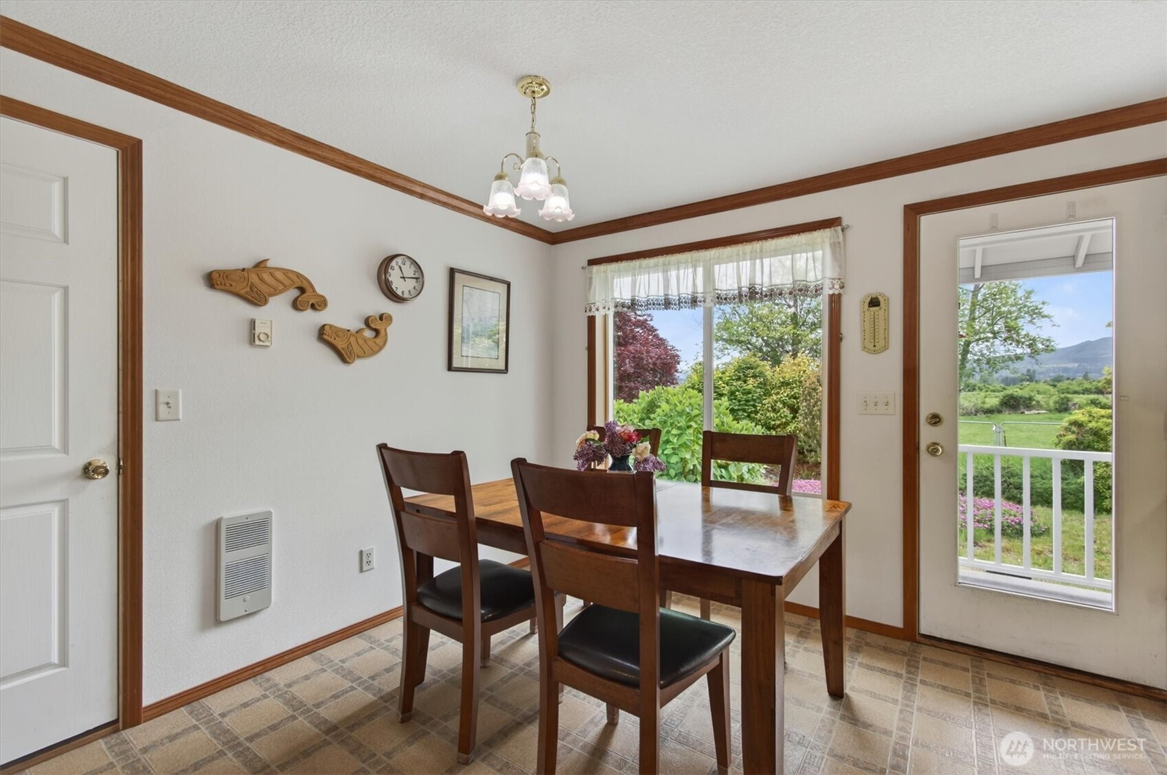 218 West Sunny Sands Road Cathlamet, WA 98612 - Photo 11 of 40 a view of a dining room with furniture window and wooden floor