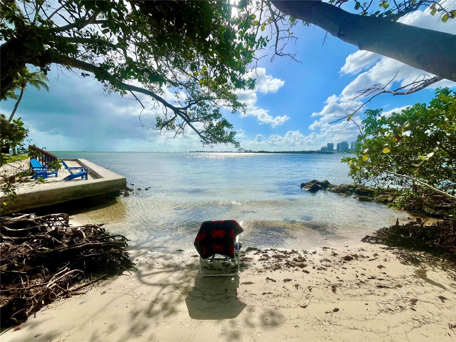 2 Grove Isle Drive, Unit B1708 Miami, FL 33133 - Photo 17 of 30 a view of a backyard of the house with a yard
