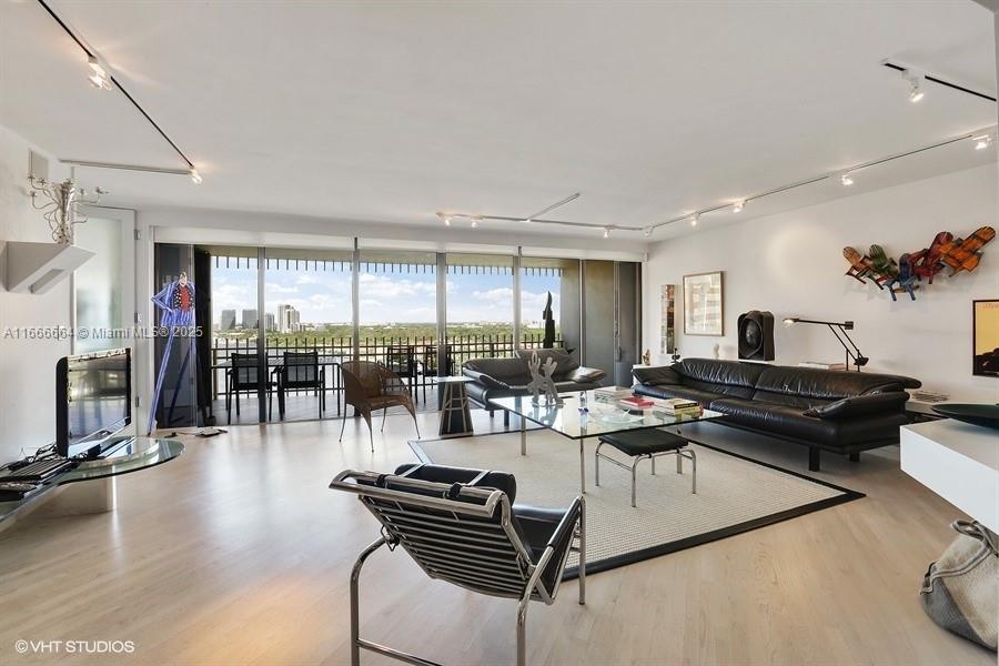 2 Grove Isle Drive, Unit B1708 Miami, FL 33133 - Photo 2 of 30 a living room with furniture a rug and a large window