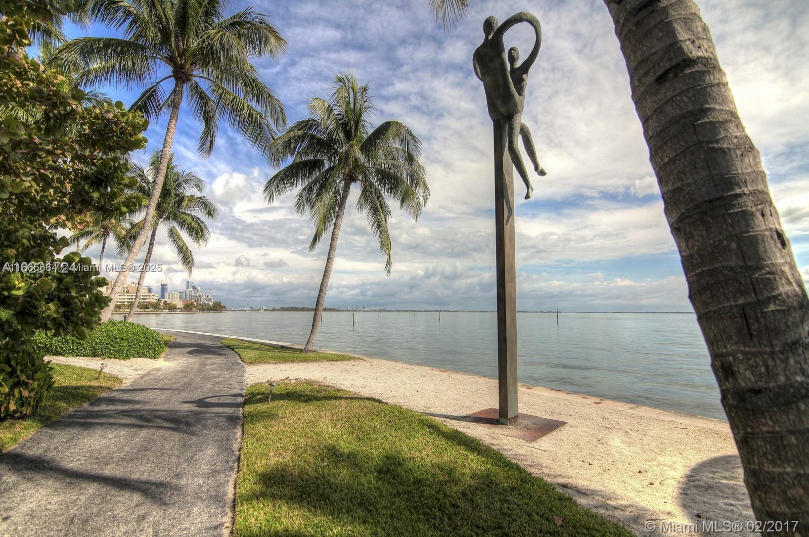 2 Grove Isle Drive, Unit B1708 Miami, FL 33133 - Photo 21 of 30 a swimming pool with view of palm trees