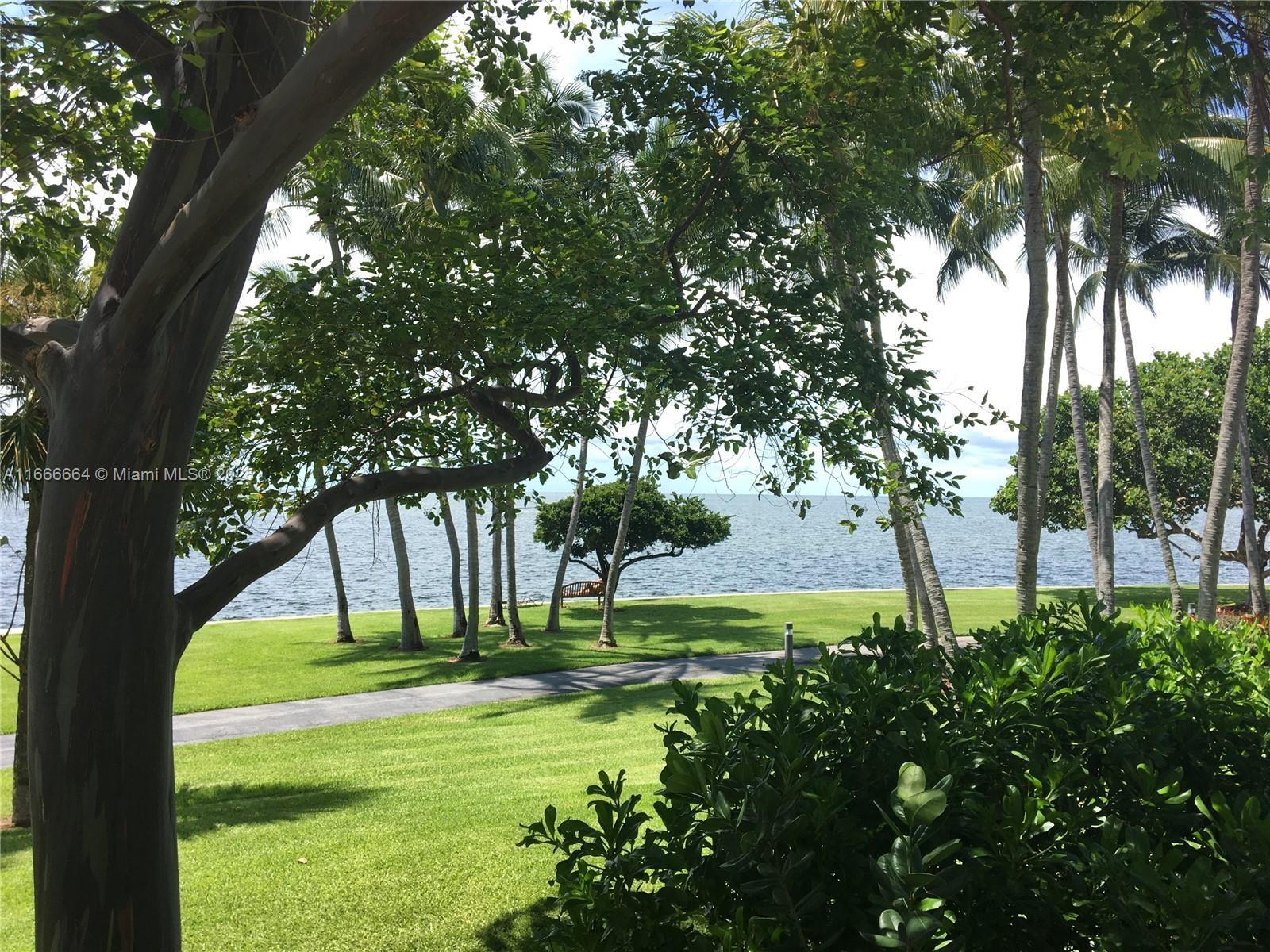 2 Grove Isle Drive, Unit B1708 Miami, FL 33133 - Photo 22 of 30 a view of swimming pool with a garden