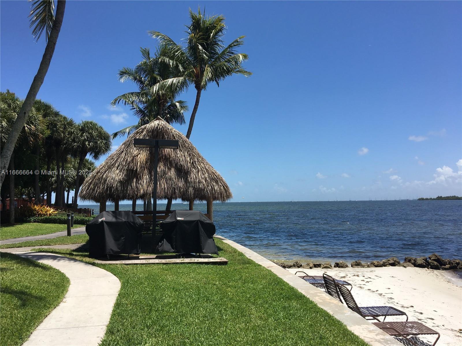 2 Grove Isle Drive, Unit B1708 Miami, FL 33133 - Photo 24 of 30 a view of a yard with a slide