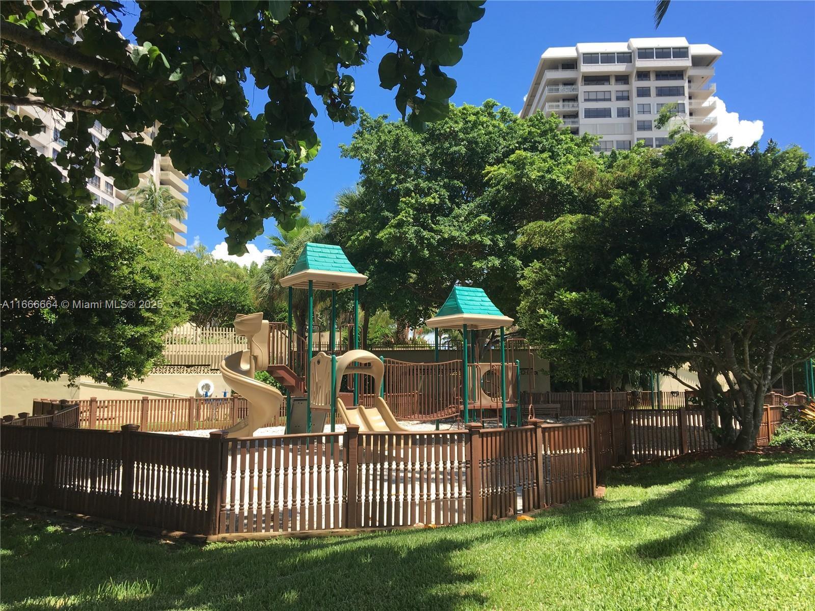 2 Grove Isle Drive, Unit B1708 Miami, FL 33133 - Photo 25 of 30 a view of a house with a yard and furniture