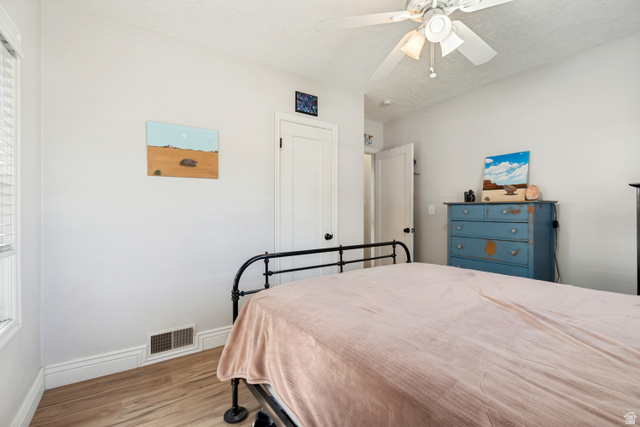 127 West 300 North Springville, UT 84663 - Photo 15 of 24 Room featuring wood flooring, white walls, and a ceiling fan with integrated lighting