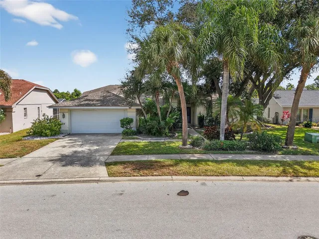 a view of a house with swimming pool and a yard