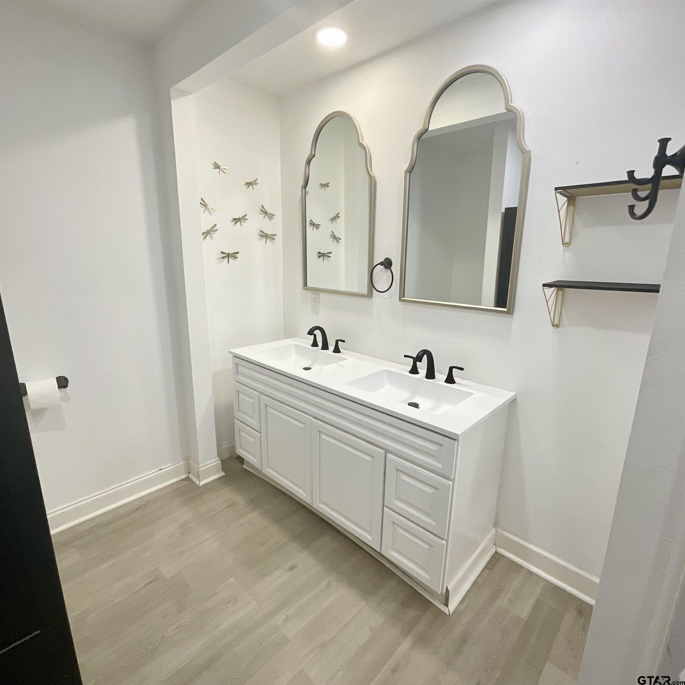 151 Patton Lane Tyler, TX 75704 - Photo 17 of 26 a bathroom with a double vanity sink mirror and bathtub