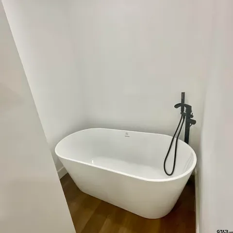 a bathroom with a shower and a toilet