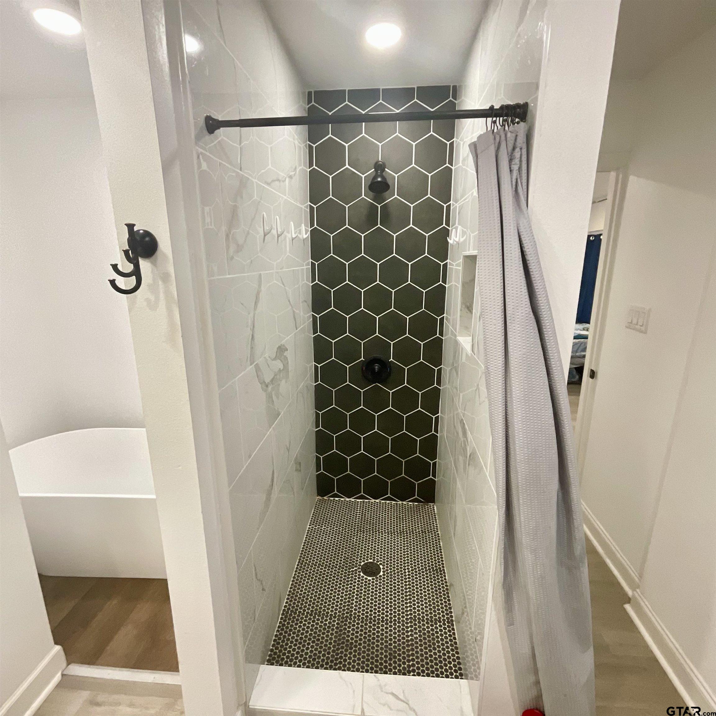 151 Patton Lane Tyler, TX 75704 - Photo 20 of 26 a bathroom with a shower and a toilet