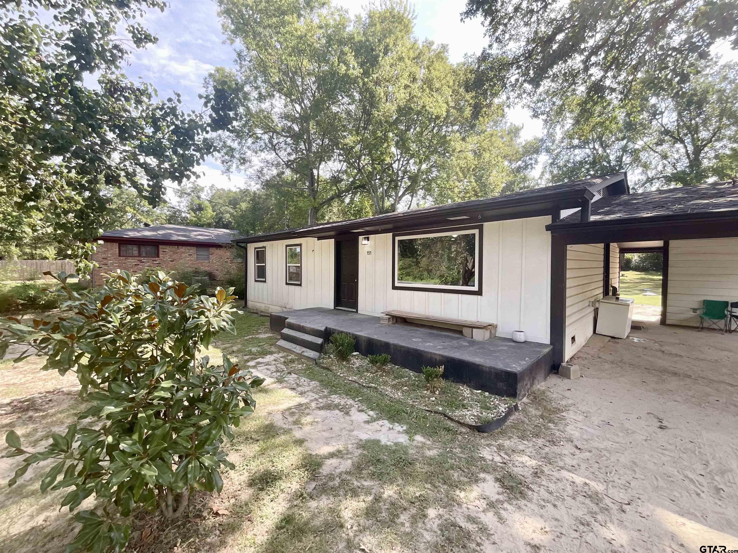 151 Patton Lane Tyler, TX 75704 - Photo 2 of 26 a view of a house with backyard and sitting area