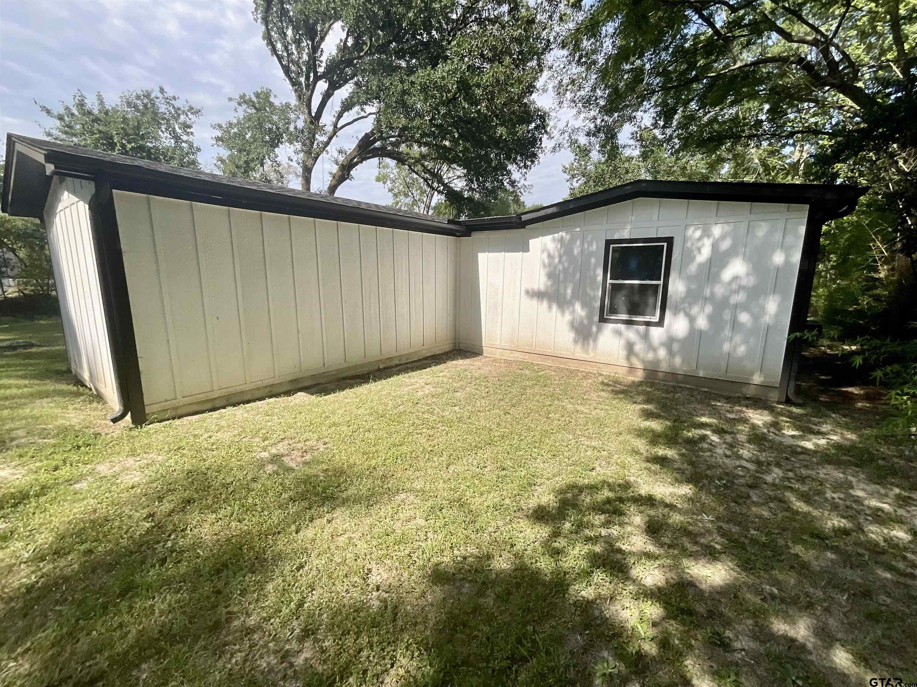 151 Patton Lane Tyler, TX 75704 - Photo 25 of 26 a house view with a backyard space