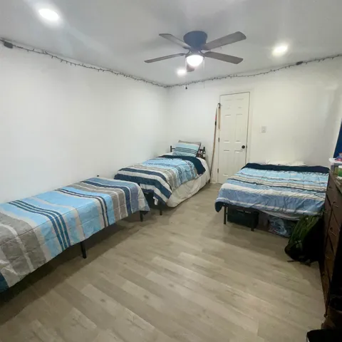 a bedroom with bed and window