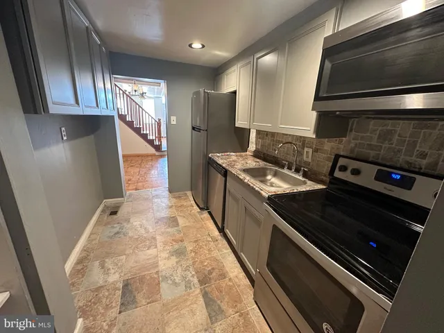 a kitchen with a stove and a microwave