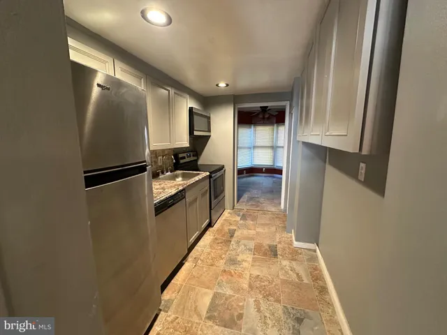 a hallway with cabinets
