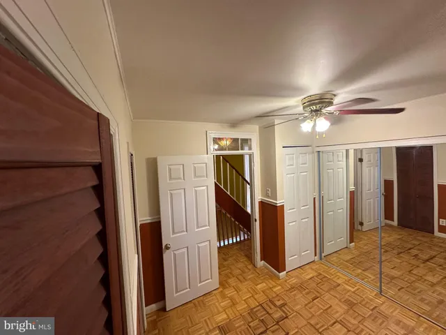 a view of entryway with stairs and wooden floor