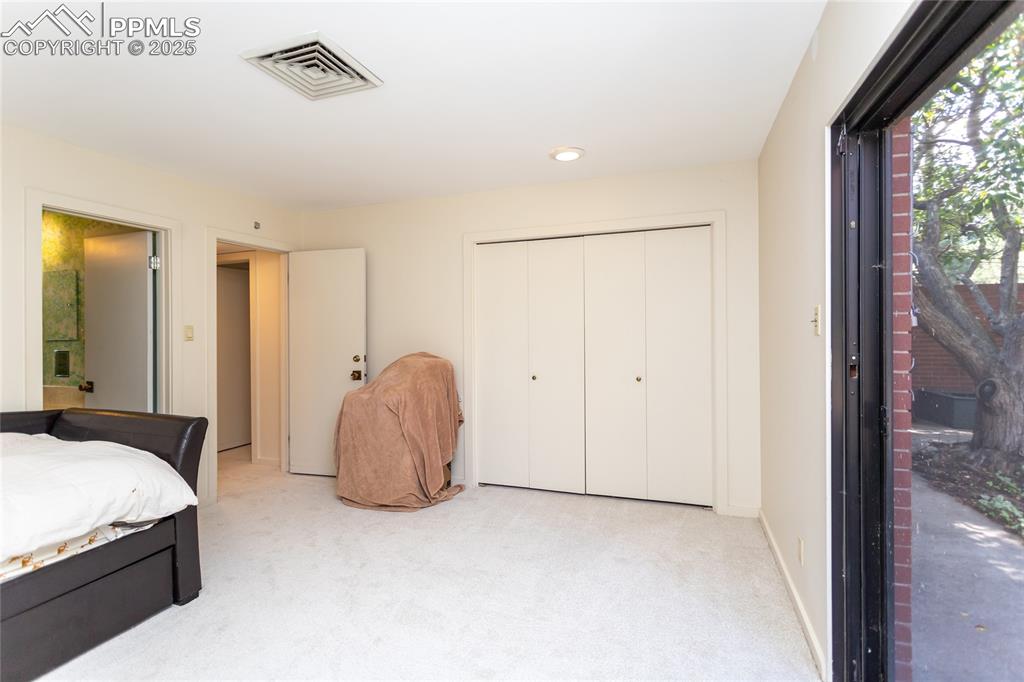 2650 Spring Grove Terrace Colorado Springs, CO 80906 - Photo 21 of 35 Bedroom with carpet flooring, a closet, and recessed lighting