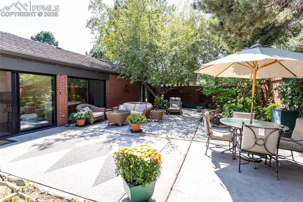 2650 Spring Grove Terrace Colorado Springs, CO 80906 - Photo 30 of 35 View of patio featuring outdoor lounge area and outdoor dining area