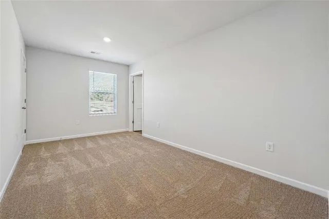 an empty room with a empty space and window