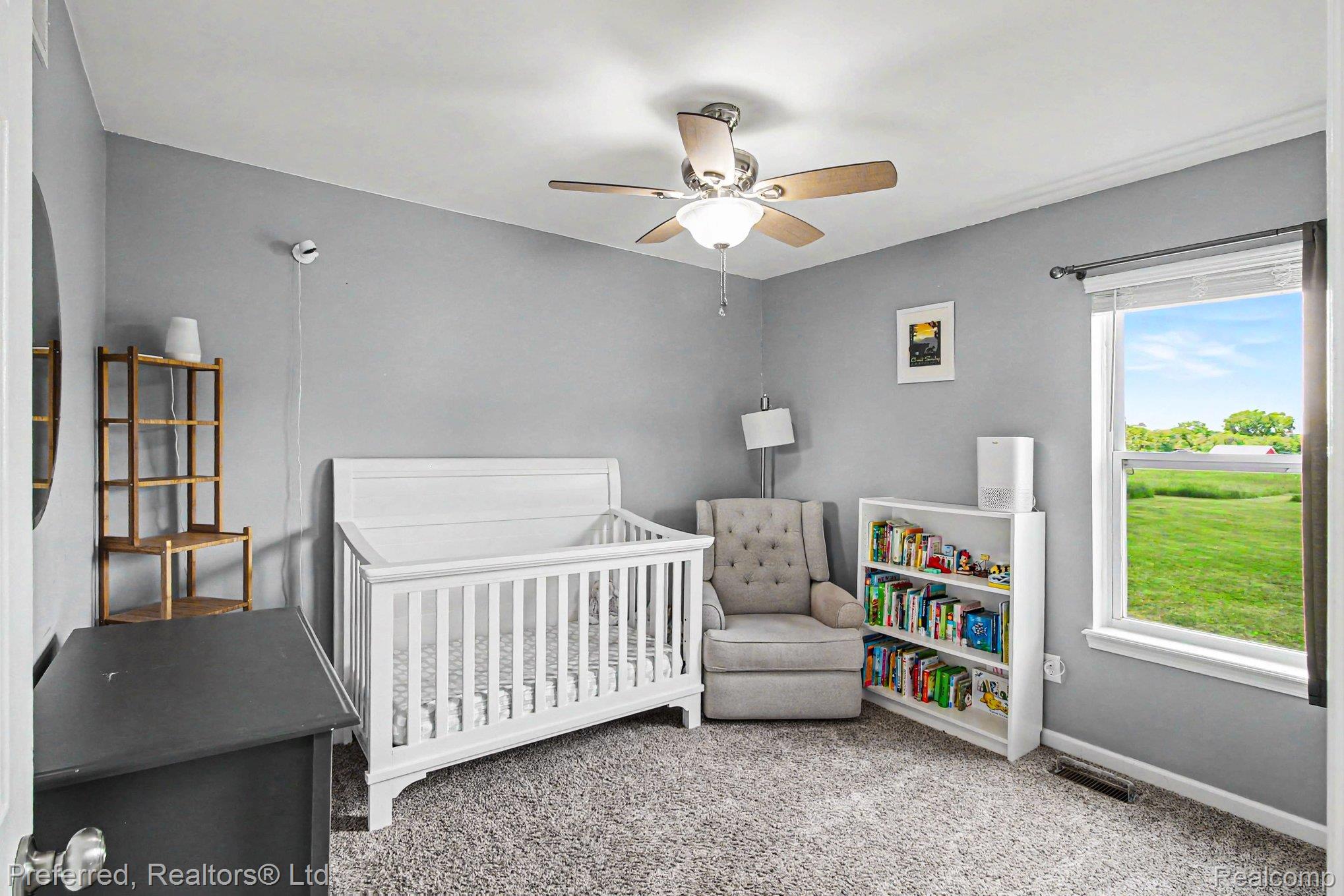 6366 Dutcher Road Howell, MI 48843 - Photo 16 of 33 Carpeted room with gray walls and a ceiling fan