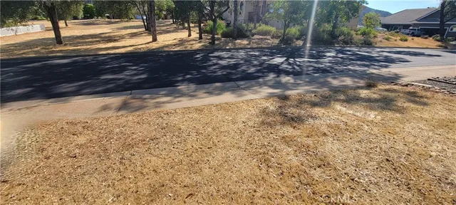 a view of yard with wooden fence