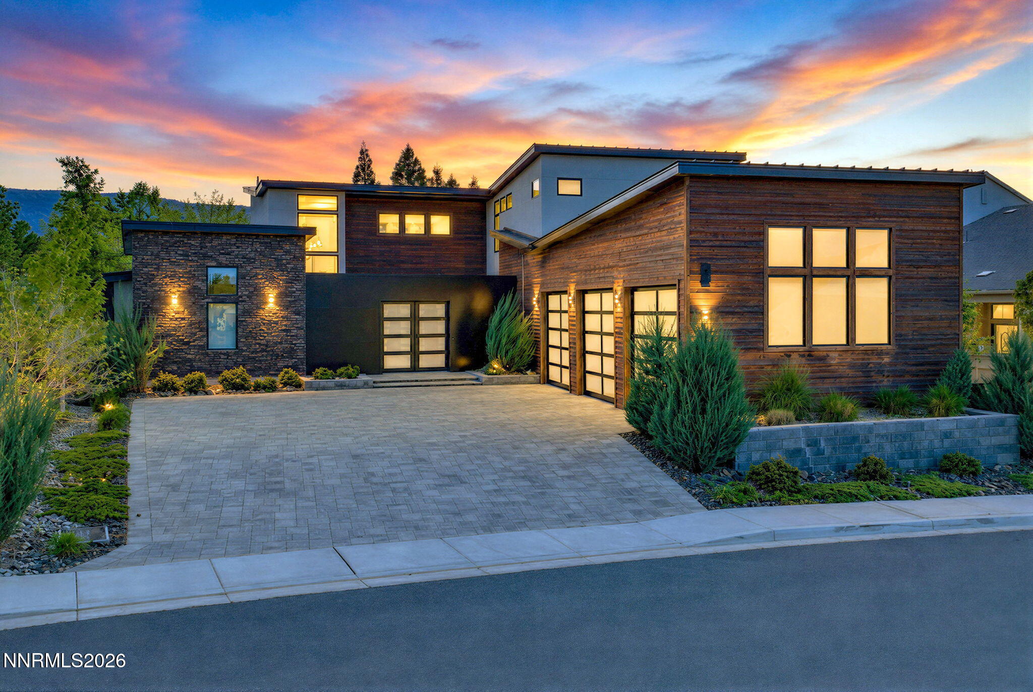 6141 Triple Crown Drive Reno, NV 89511 - Photo 1 of 71 a front view of a house with a yard and garage