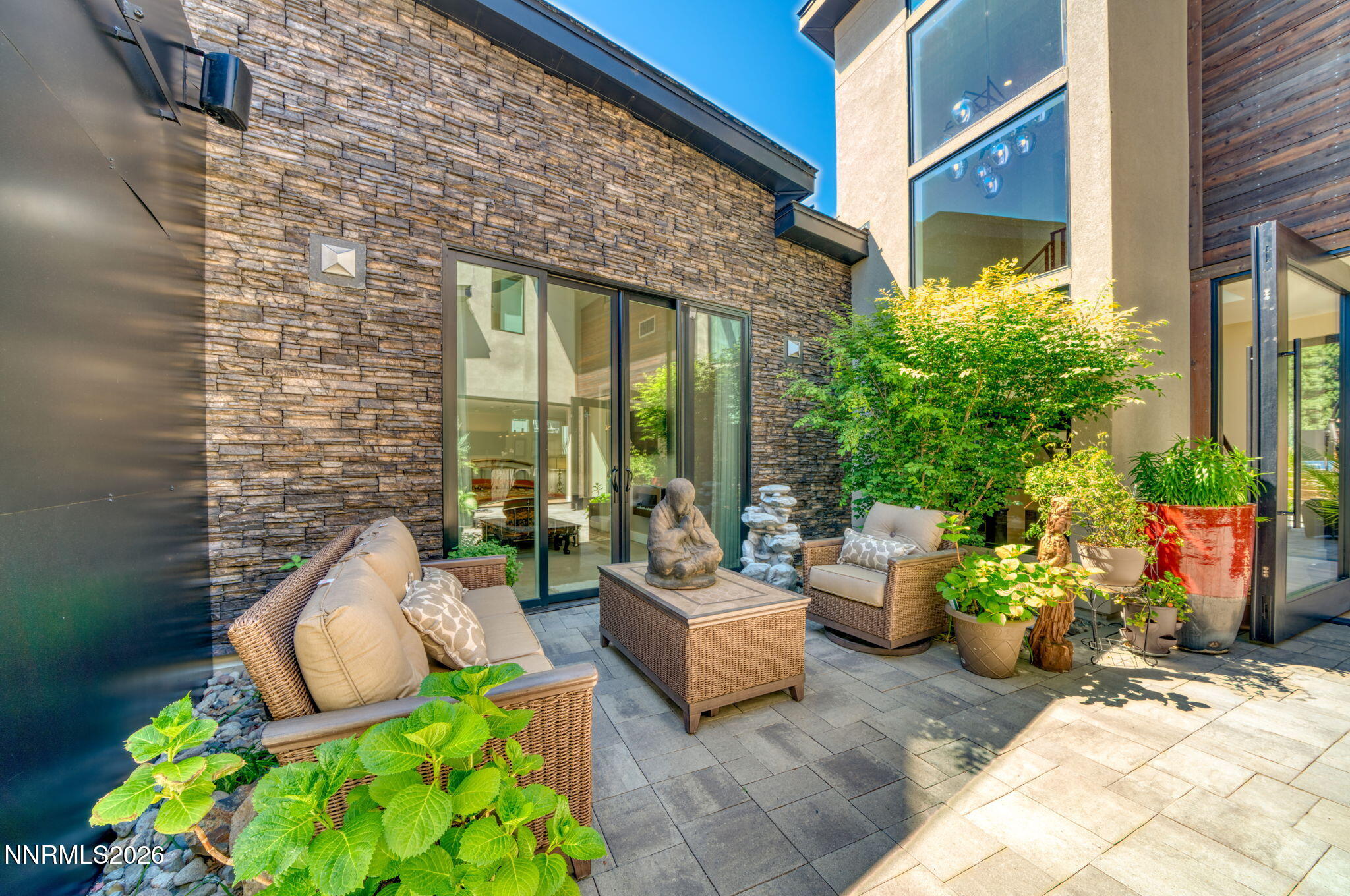 6141 Triple Crown Drive Reno, NV 89511 - Photo 20 of 71 a view of a patio with plants and chairs