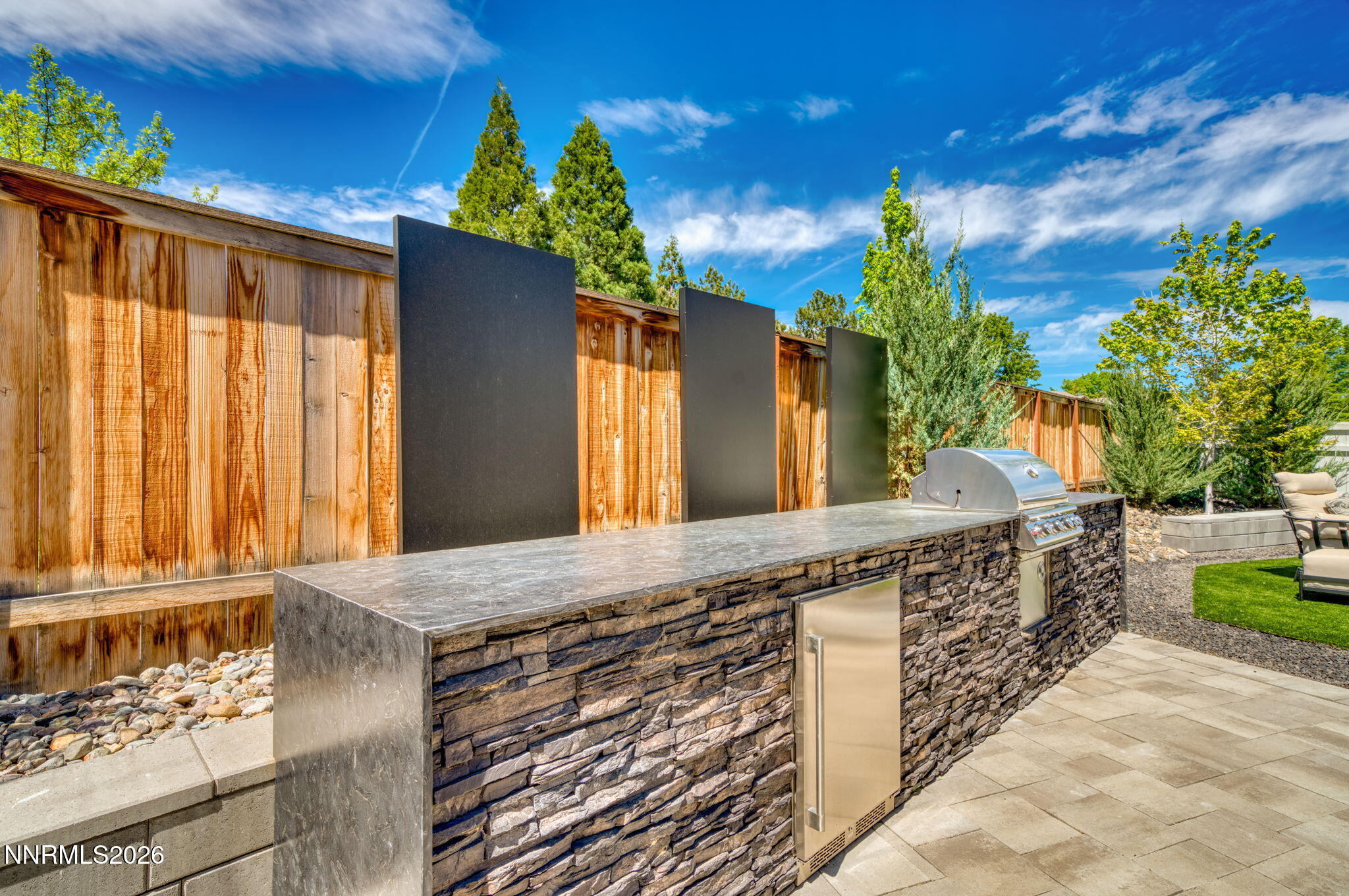 6141 Triple Crown Drive Reno, NV 89511 - Photo 28 of 71 a bathroom with a granite countertop sink and a large mirror