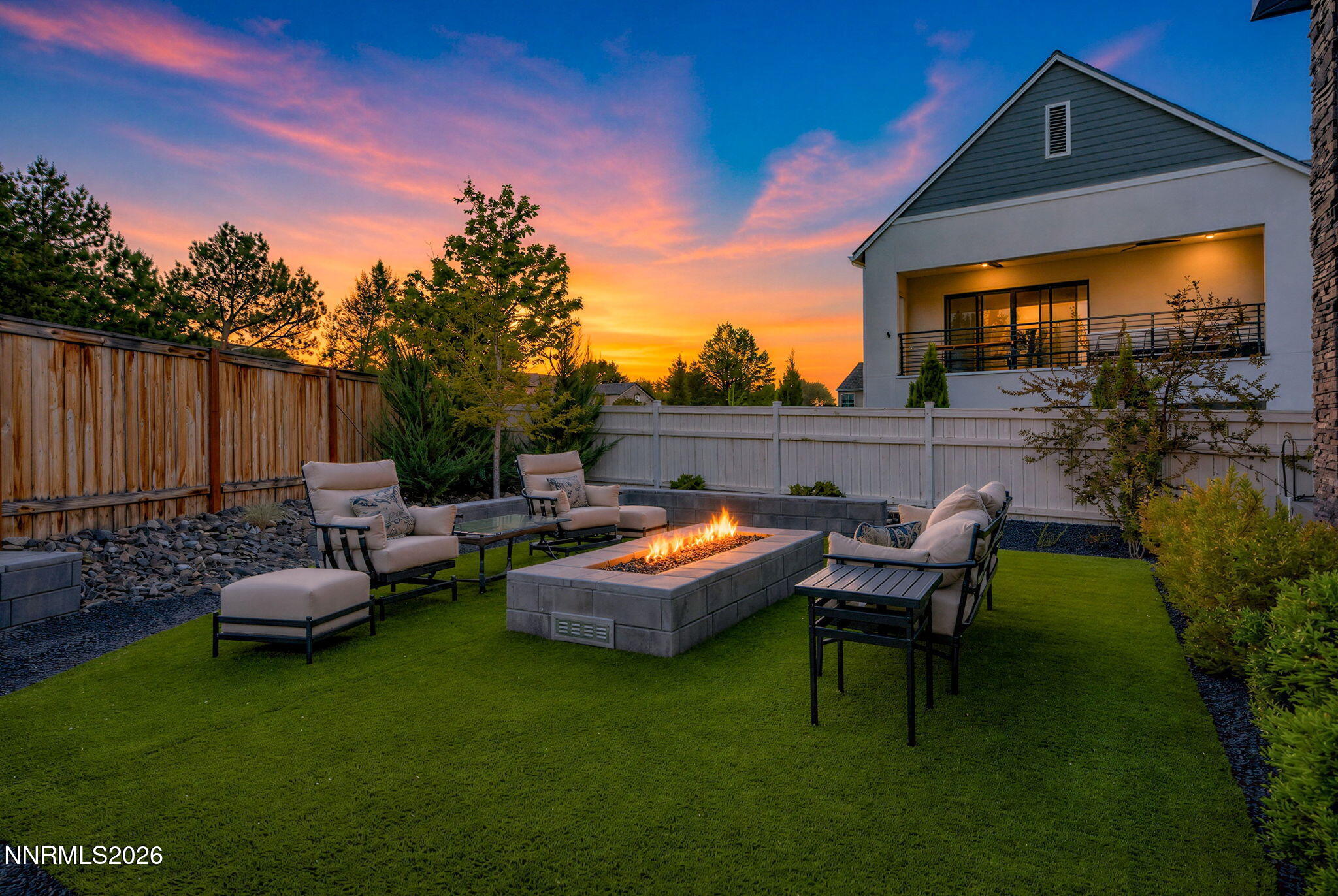 6141 Triple Crown Drive Reno, NV 89511 - Photo 4 of 71 a backyard of a house with table and chairs