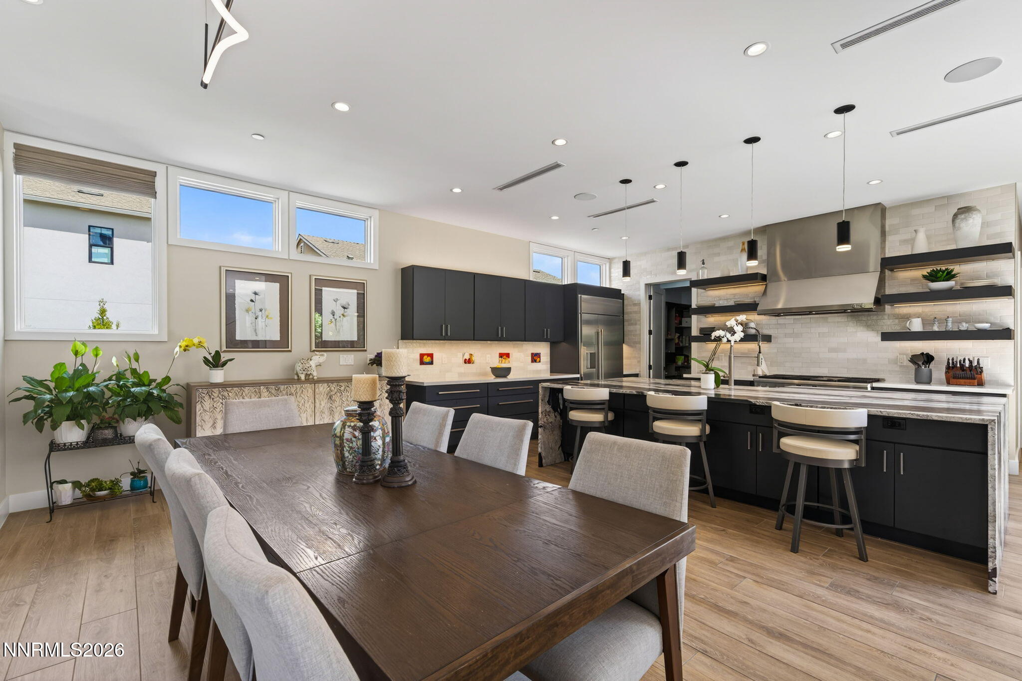 6141 Triple Crown Drive Reno, NV 89511 - Photo 43 of 71 a view of a dining room with furniture and wooden floor
