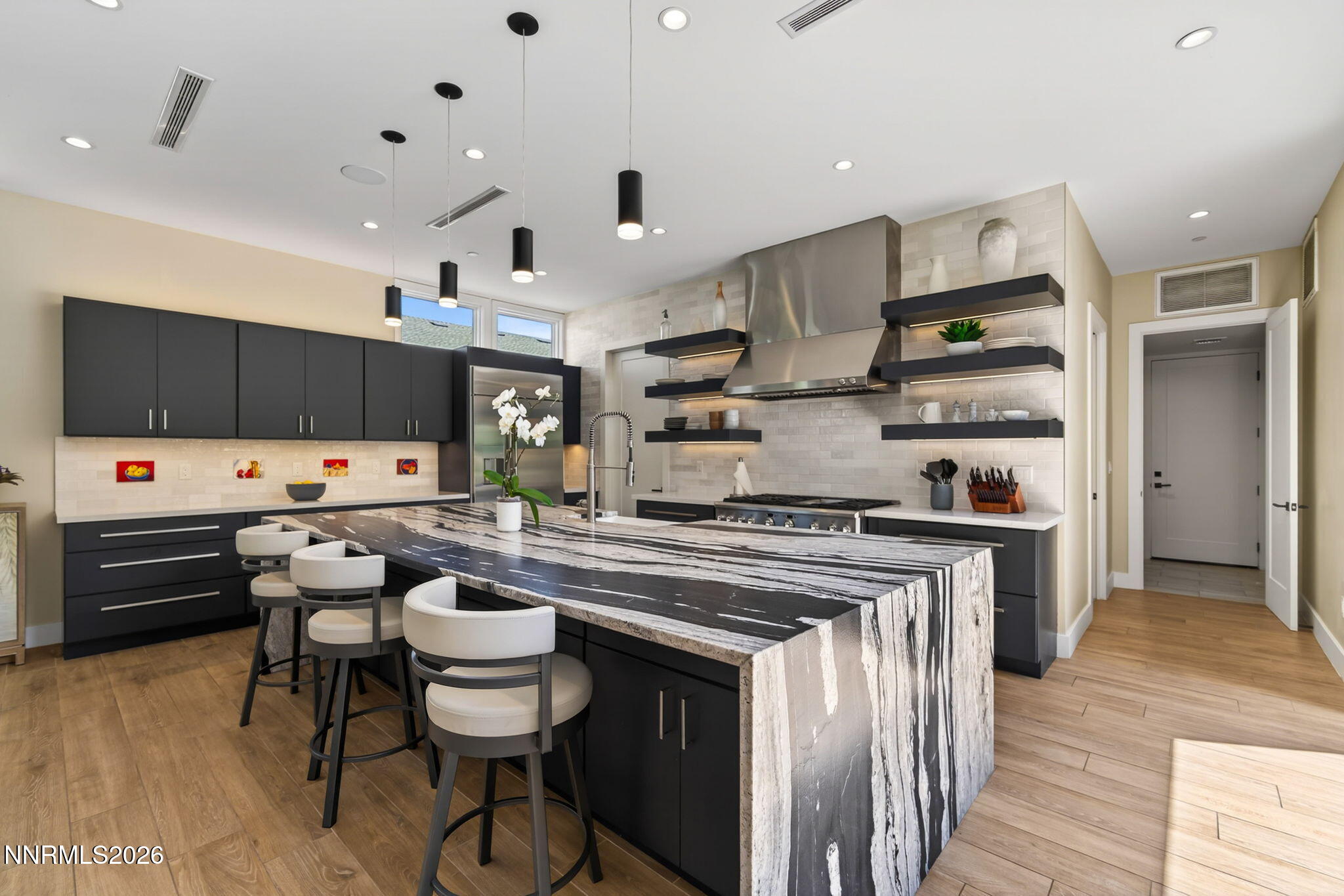 6141 Triple Crown Drive Reno, NV 89511 - Photo 45 of 71 a kitchen with stainless steel appliances a stove a sink dishwasher and a refrigerator