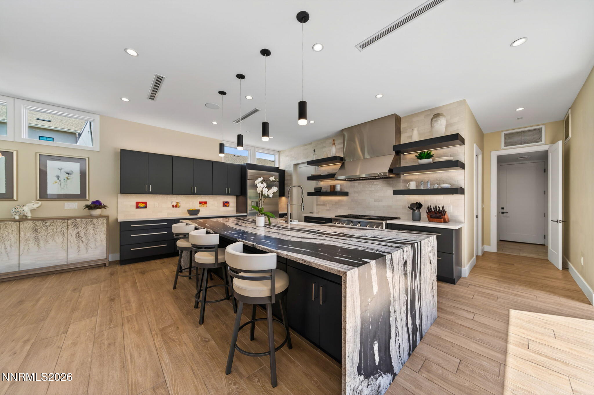 6141 Triple Crown Drive Reno, NV 89511 - Photo 47 of 71 a open kitchen with stainless steel appliances granite countertop a stove and a refrigerator