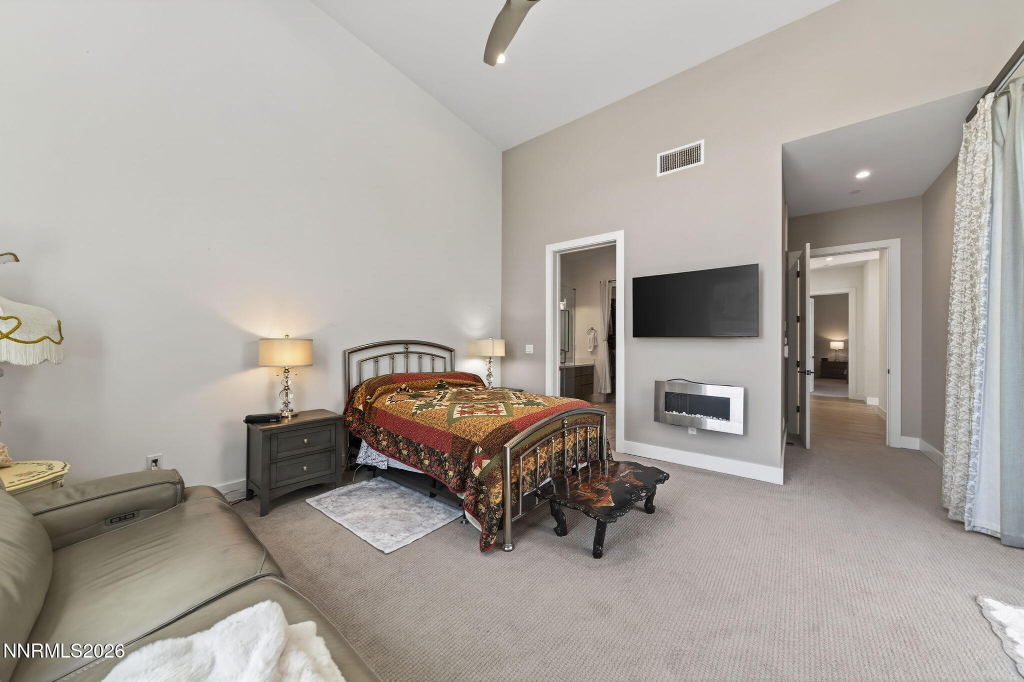 6141 Triple Crown Drive Reno, NV 89511 - Photo 54 of 71 a bedroom with a bed and a television