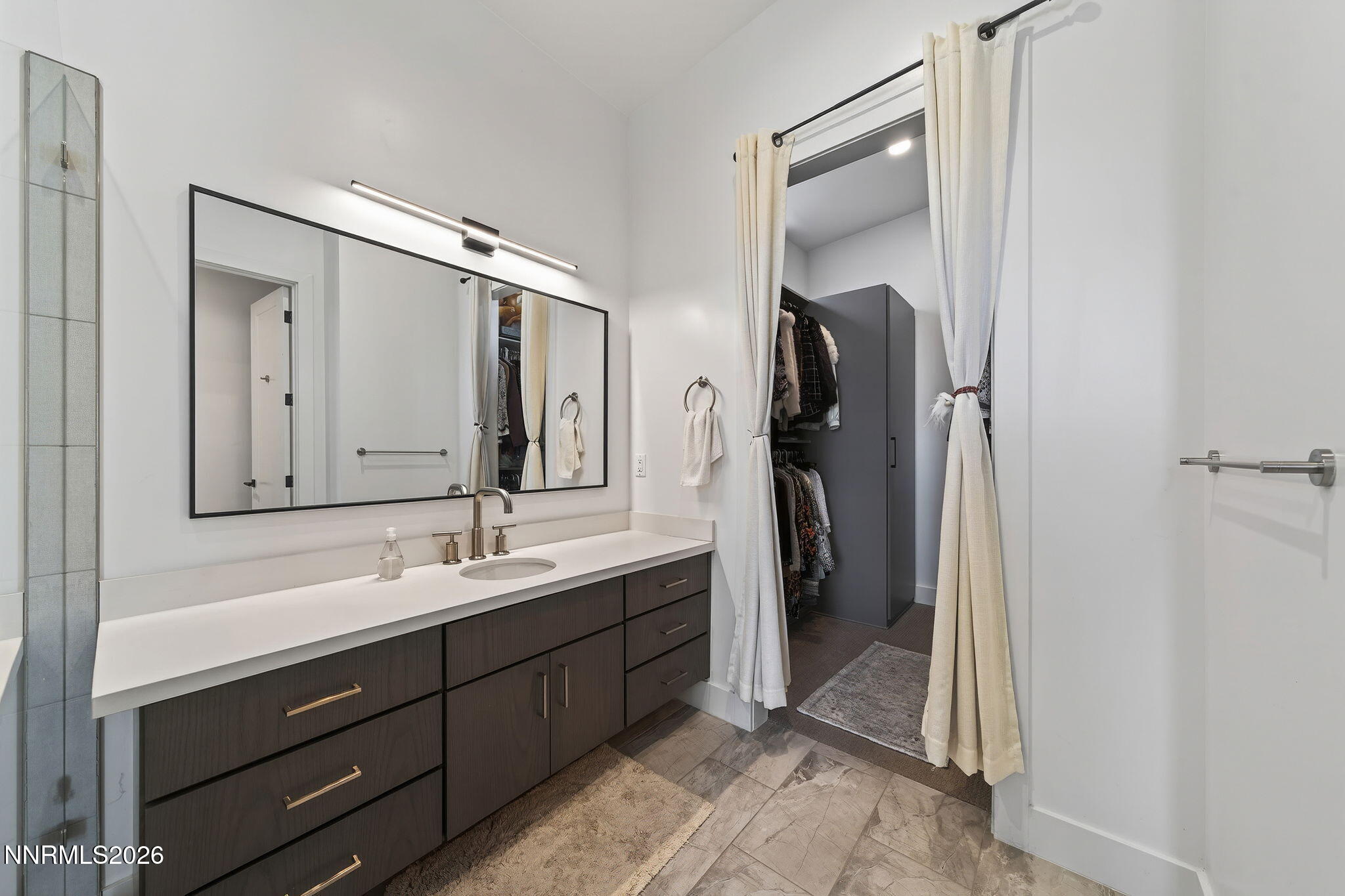 6141 Triple Crown Drive Reno, NV 89511 - Photo 55 of 71 a bathroom with a double vanity sink mirror and double