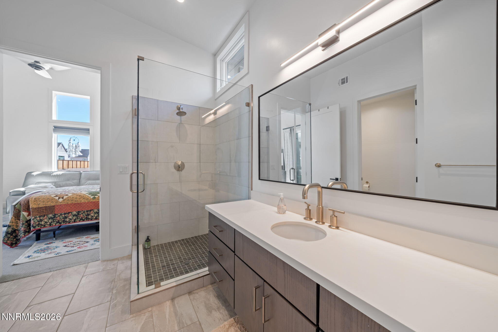 6141 Triple Crown Drive Reno, NV 89511 - Photo 56 of 71 a bathroom with a sink and a mirror